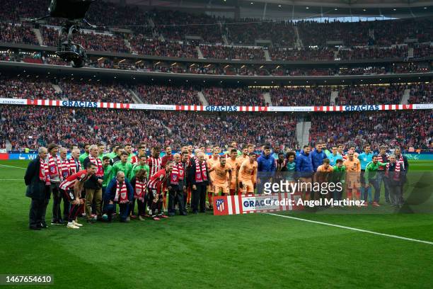 Players and former players of Atletico de Madrid and of Athletic Club pose prior to the LaLiga Santander match between Atletico de Madrid and...