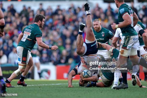 Billy Vunipola of Saracens is tackled by Jasper Wiese of Leicester Tigers during the Gallagher Premiership Rugby match between Leicester Tigers and...