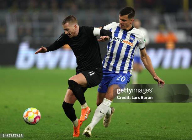 Marco Reus of Borussia Dortmund is challenged by Marc-Oliver Kempf of Hertha Berlin during the Bundesliga match between Borussia Dortmund and Hertha...