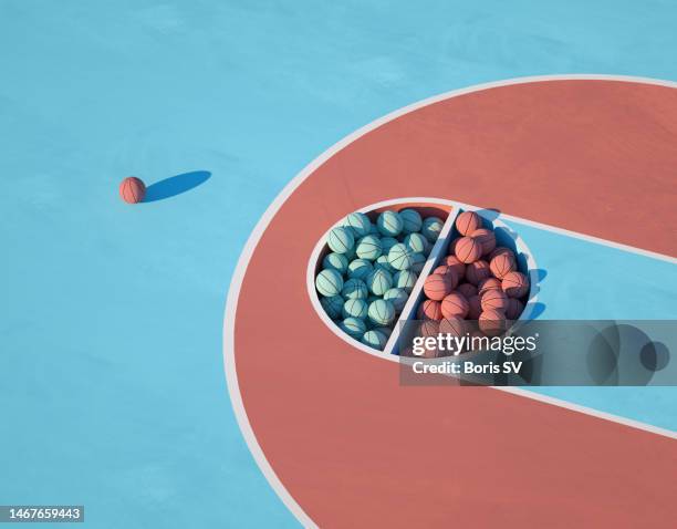 basketballs in separate pits - atirar ao cesto imagens e fotografias de stock