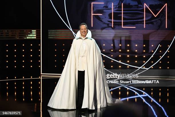 Host, Richard E. Grant speaks on stage during the EE BAFTA Film Awards 2023 at The Royal Festival Hall on February 19, 2023 in London, England.