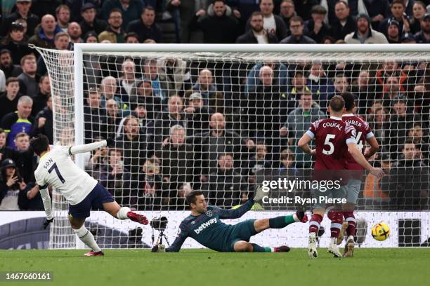 Son Heung-Min of Tottenham Hotspur scores the team's second goal as Lukasz Fabianski of West Ham United looks on during the Premier League match...