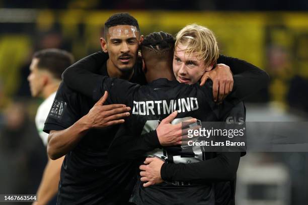 Julian Brandt of Borussia Dortmund celebrates after scoring the team's fourth goal with teammates during the Bundesliga match between Borussia...