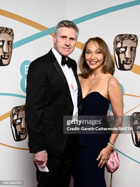 Dominic Tuohy and a guest attend the EE BAFTA Film Awards 2023 at The Royal Festival Hall on February 19, 2023 in London, England.