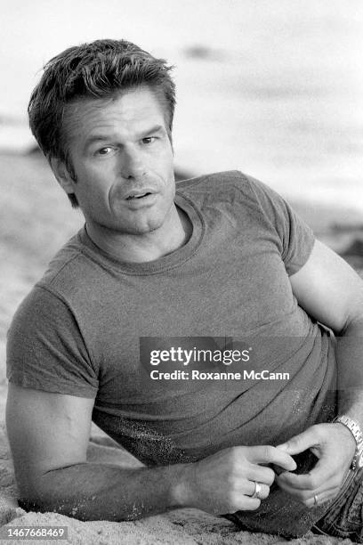 Actor Harry Hamlin enjoys the sunset on the beach in June, 1998 in Malibu, California.