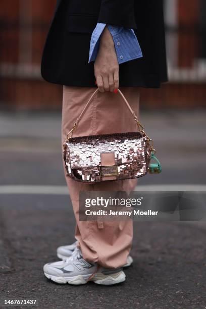 Sonia Lyson seen wearing Fendi Baguette light pink sequins pattern bag and Fendi Nano Baguette green micro bag, New Balance 9060 white / grey...