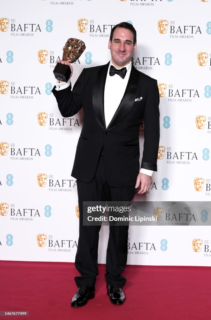 james-friend-poses-with-the-cinematography-award-for-all-quiet-on-the-western-front-during-the.jpg