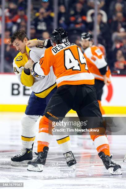 Tanner Jeannot of the Nashville Predators and Nicolas Deslauriers of the Philadelphia Flyers fight at Wells Fargo Center on February 11, 2023 in...