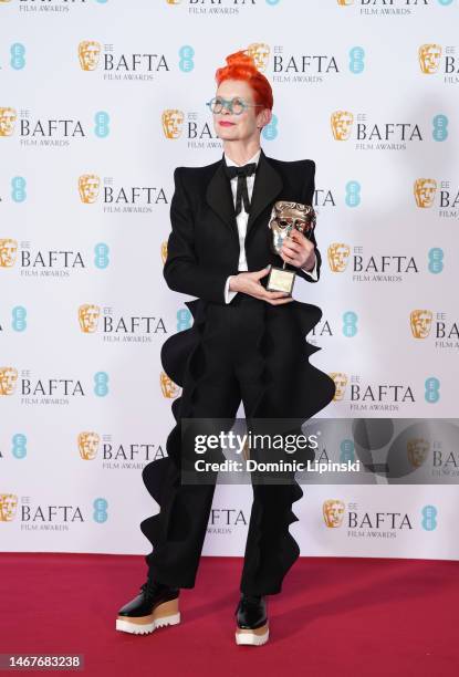 Sandy Powell poses with the Fellowship Award at the 2023 EE British Academy Film Awards, held at the Royal Festival Hall on February 19, 2023 in...