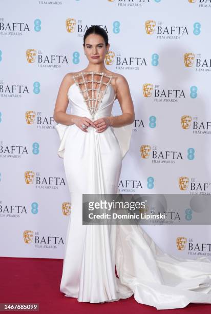 Lily James poses during the EE BAFTA Film Awards 2023 at The Royal Festival Hall on February 19, 2023 in London, England.