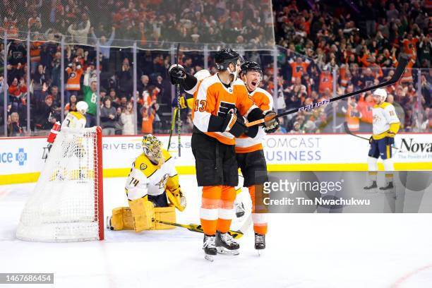 Patrick Brown and Kevin Hayes of the Philadelphia Flyers celebrate a goal by Hayes against the Nashville Predators at Wells Fargo Center on February...