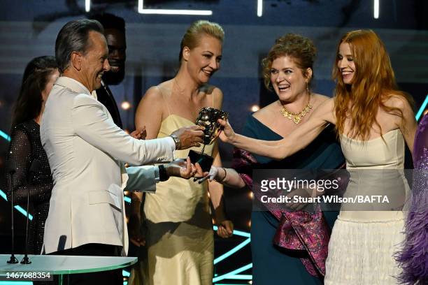 Richard E. Grant presents Producer Melanie Miller and Producer Odessa Rae with the Documentary Award for 'Navalny' during the 2023 EE BAFTA Film...