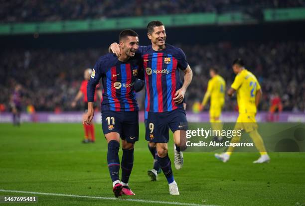Robert Lewandowski of FC Barcelona celebrates after scoring the team's second goal with teammate Ferran Torres during the LaLiga Santander match...