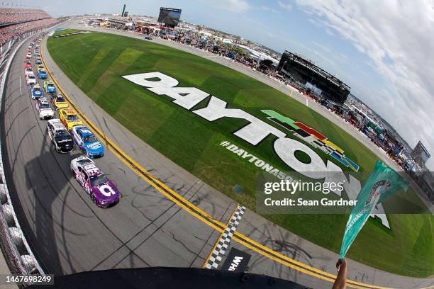 Alex Bowman, driver of the Ally Chevrolet, leads the field to the green flag to start the NASCAR Cup Series 65th Annual Daytona 500 at Daytona...