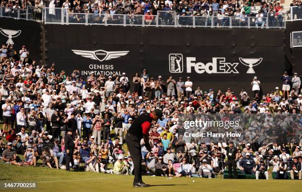 Tiger Woods of the United States putts on the 18th green during the final round of the Genesis Invitational at Riviera Country Club on February 19,...