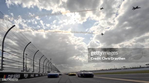 Alex Bowman, driver of the Ally Chevrolet, and Kyle Larson, driver of the HendrickCars.com Chevrolet, lead the field on a pace lap as the U.S. Air...