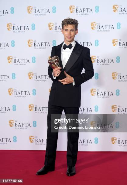 Austin Butler poses with the Leading Actor Award for his performance in 'Elvis' during the 2023 EE BAFTA Film Awards, held at the Royal Festival Hall...