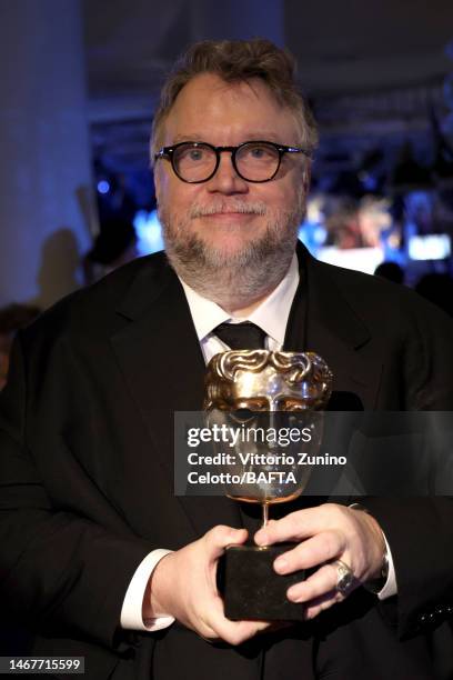 Director Guillermo del Toro poses with the Best Animated Film award during the EE BAFTA Film Awards 2023 Dinner at the Royal Festival Hall on...