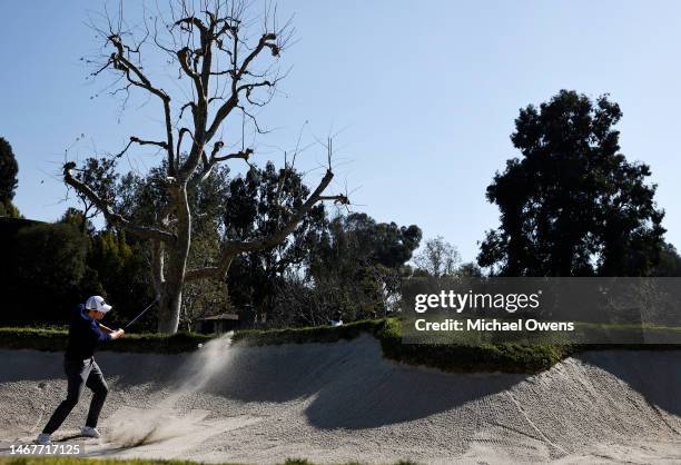 Patrick Cantlay of the United States plays his shot from a bunker on the 16th hole during the final round of the Genesis Invitational at Riviera...