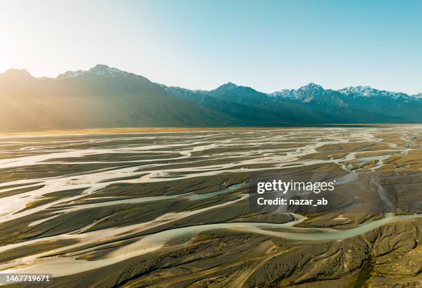 glacier water from mt cook mountain range. - braided river stock pictures, royalty-free photos & images