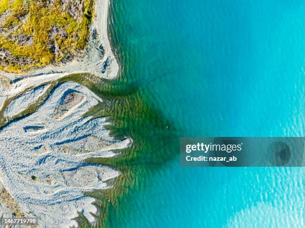 surface level of glacial river watere. - braided river stock pictures, royalty-free photos & images