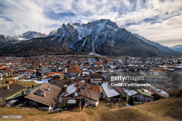 cityscape of mittenwald with karwendel in the background in late winter - mittenwald ストックフォトと画像