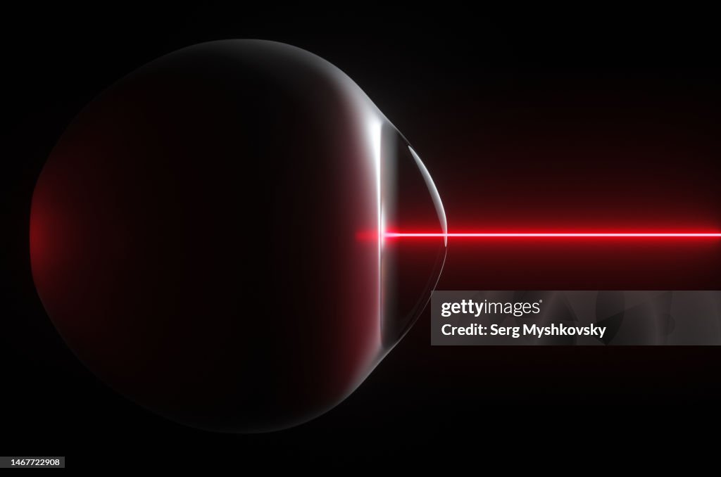 Silhouette of a human eye during a scanning procedure by a lake side view on a black background.