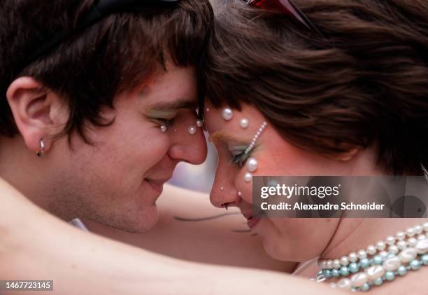 Revelers hug during the annual street block party know as "Explode Coracao" on the third day of Carnival on February 19, 2023 in Sao Paulo, Brazil....