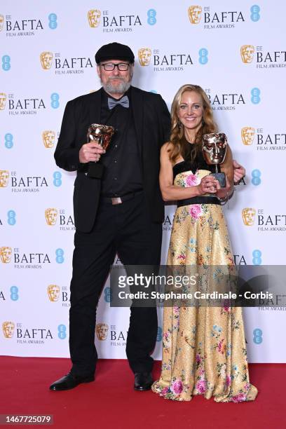 Ian Stokell and Lesley Paterson, winners of the Best Film award for "All Quiet On The Western Front", pose in the Winners room during the EE BAFTA...
