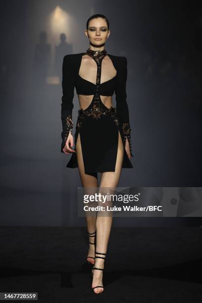 Model walks the runway at the Julien Macdonald show during London Fashion Week February 2023 on February 19, 2023 in London, England.
