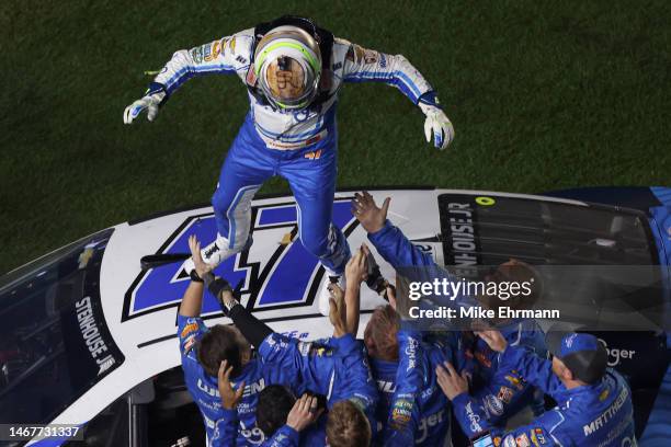 Ricky Stenhouse Jr., driver of the Kroger/Cottonelle Chevrolet, celebrates with his crew after winning the NASCAR Cup Series 65th Annual Daytona 500...