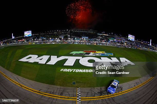 Ricky Stenhouse Jr., driver of the Kroger/Cottonelle Chevrolet, celebrates after winning the NASCAR Cup Series 65th Annual Daytona 500 at Daytona...