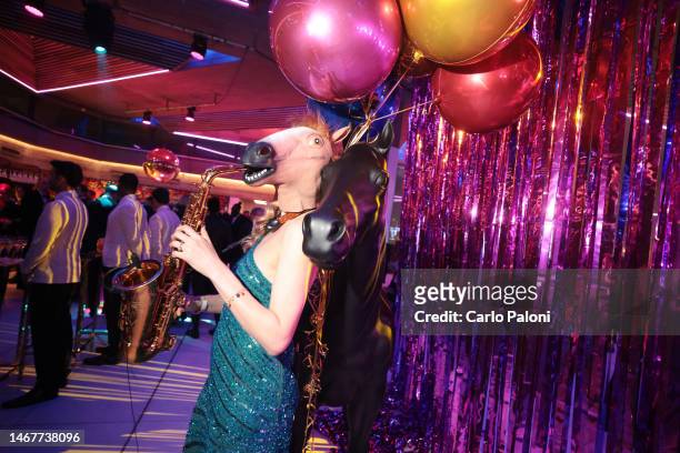 Saxophonist with horse mask plays at the EE BAFTA Film Awards 2023 After Party at the Queen Elizabeth Hall on February 19, 2023 in London, England.