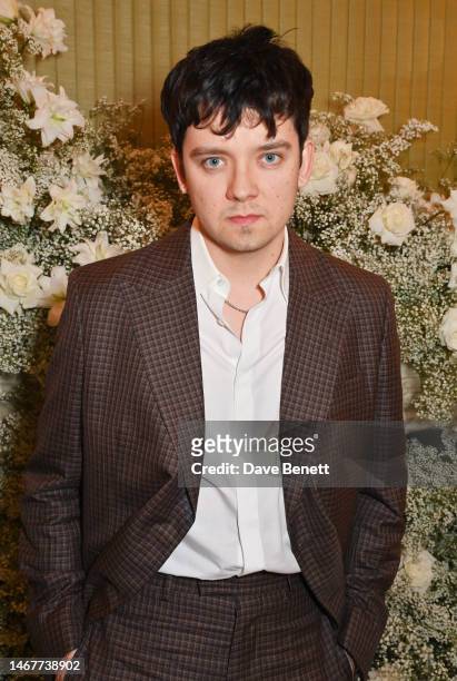 Asa Butterfield attends the British Vogue And Tiffany & Co. Celebrate Fashion And Film Party 2023 at Annabel's on February 19, 2023 in London,...
