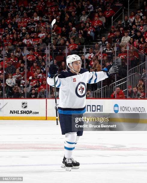 Neal Pionk of the Winnipeg Jets celebrates his goal at 17:09 of the first period against the New Jersey Devils at the Prudential Center on February...