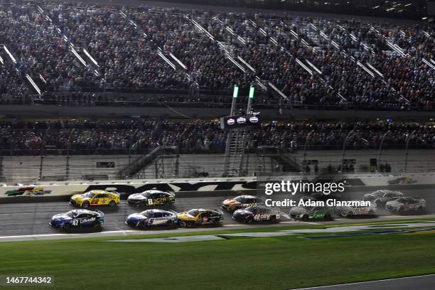 Ricky Stenhouse Jr., driver of the Kroger/Cottonelle Chevrolet, leads the Joey Logano, driver of the Shell Pennzoil Ford, and Kyle Larson, driver of...