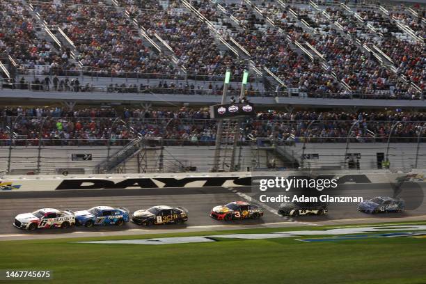Brad Keselowski, driver of the Nexlizet Ford, leads Chris Buescher, driver of the Fastenal Ford, during the NASCAR Cup Series 65th Annual Daytona 500...