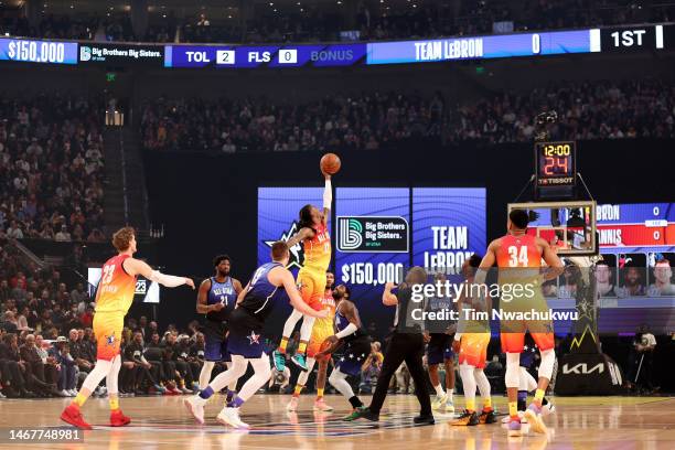 Ja Morant of the Memphis Grizzlies grabs the tip to start the 2023 NBA All Star Game between Team Giannis and Team LeBron at Vivint Arena on February...