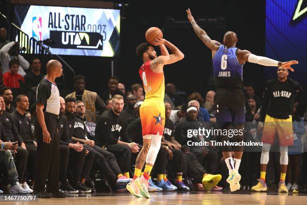 Jayson Tatum of the Boston Celtics shoots against LeBron James of the Los Angeles Lakers in the 2023 NBA All Star Game between Team Giannis and Team...