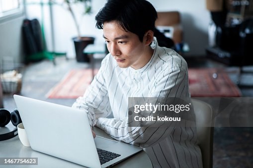 Pensive man working on laptop in the office Pensive man working on laptop in the office