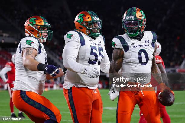Josh Gordon of the Seattle Sea Dragons celebrates with teammates after catching a pass for a touchdown against the DC Defenders during the first half...