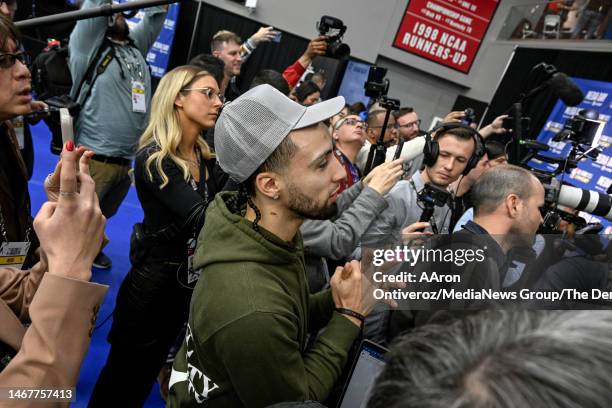 Jose Alvarado of the New Orleans Pelicans joins the press as he asks Nikola Jokic of the Denver Nuggets what his favorite breed of horse is during...