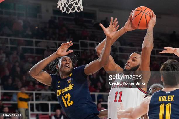Joel Soriano of the St. John's Red Storm grabs a rebound against Olivier-Maxence Prosper of the Marquette Golden Eagles at Carnesecca Arena on...