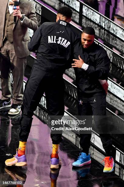 Damian Lillard of the Portland Trailblazers hugs Giannis Antetokounmpo of the Milwaukee Bucks prior to the 2023 NBA All Star Game between Team...