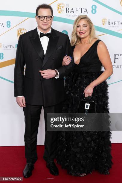 Brendan Fraser and Jeanne Moore attend the EE BAFTA Film Awards 2023 at The Royal Festival Hall on February 19, 2023 in London, England.