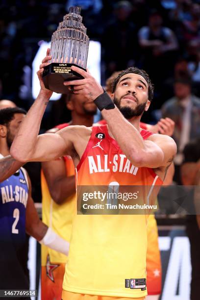 Jayson Tatum of the Boston Celtics hoists The Kobe Bryant MVP Trophy after the 2023 NBA All Star Game between Team Giannis and Team LeBron at Vivint...