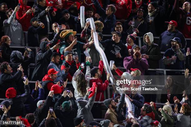 Fans build a beer cup snake during the second half of the XFL game between the DC Defenders and the Seattle Sea Dragons at Audi Field on February 19,...