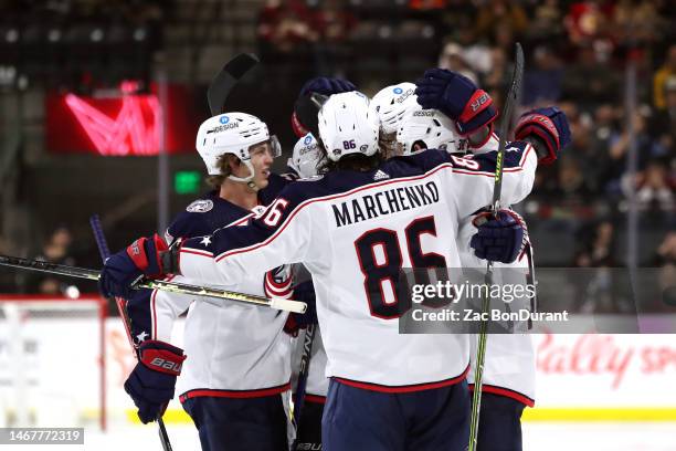 Kirill Marchenko of the Columbus Blue Jackets, Kent Johnson of the Columbus Blue Jackets celebrate after a Patrik Laine of the Columbus Blue Jackets...