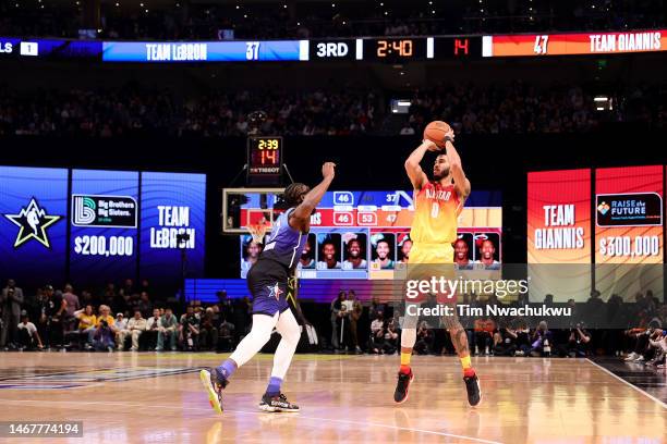 Jayson Tatum of the Boston Celtics shoots over Jaylen Brown of the Boston Celtics during the second half in the 2023 NBA All Star Game between Team...