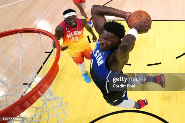 Anthony Edwards of the Minnesota Timberwolves dunks against Pascal Siakam of the Toronto Raptors in the 2023 NBA All Star Game between Team Giannis...